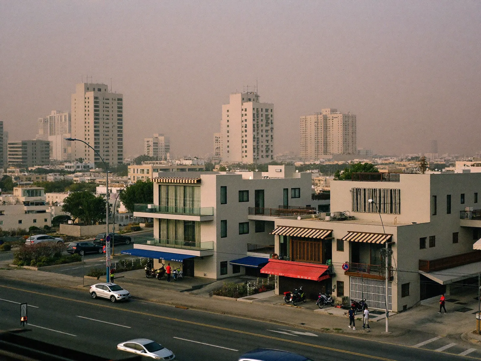 Modern villas and low-rise buildings in Al Barsha South under a hazy Dubai sky
