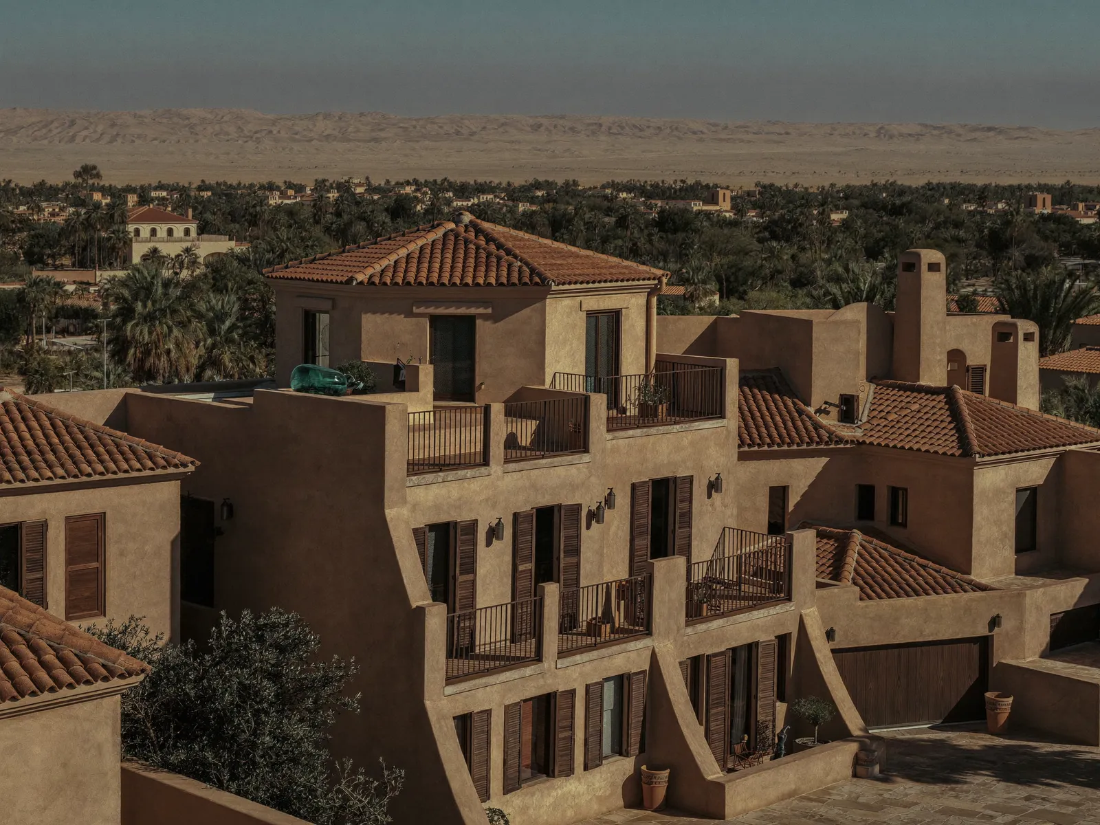 Mediterranean-style villa in Arabian Ranches with a white water tank on the flat roof section