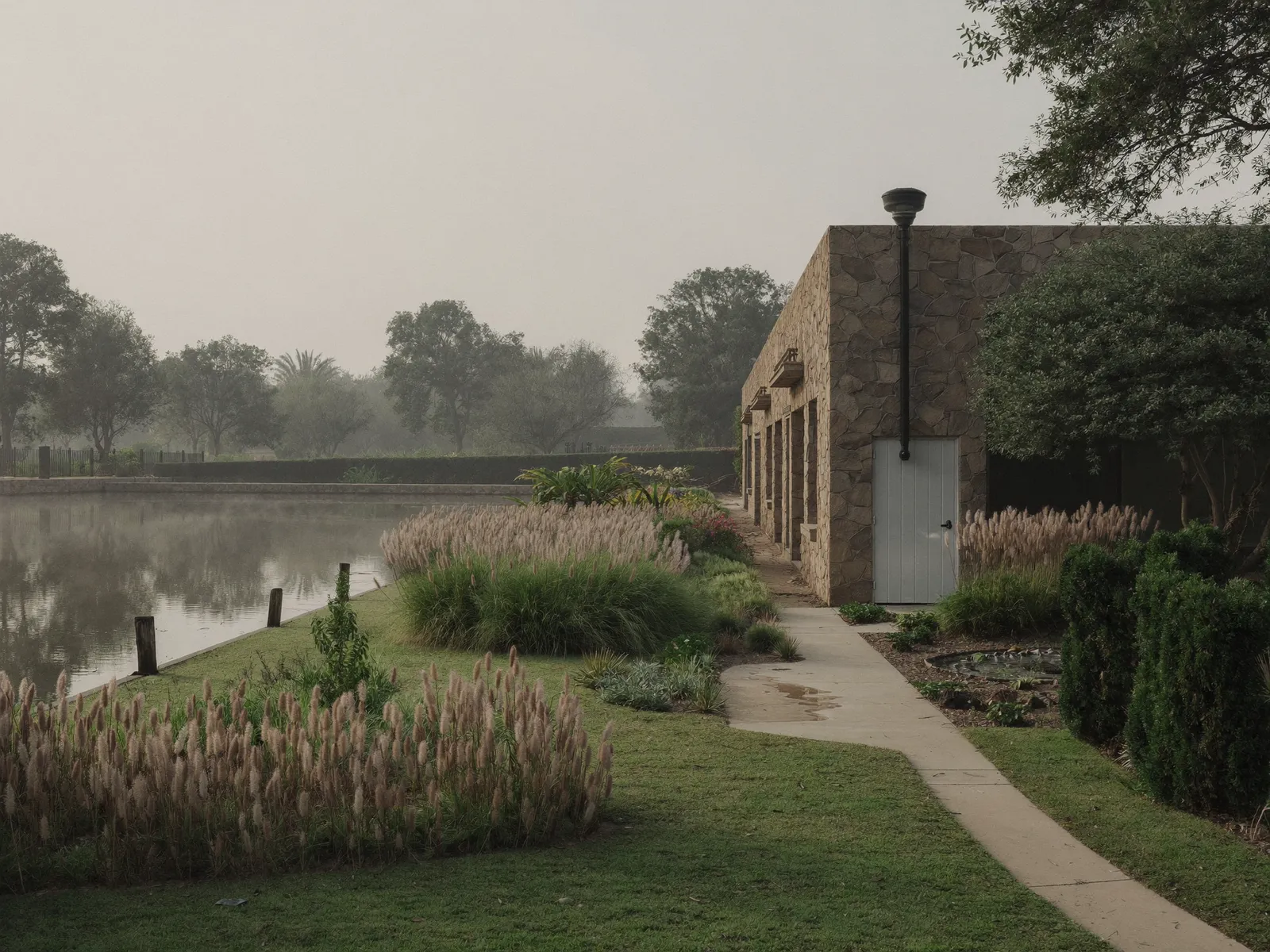 Villa in The Lakes, Dubai, with a garden service yard and a pump room door